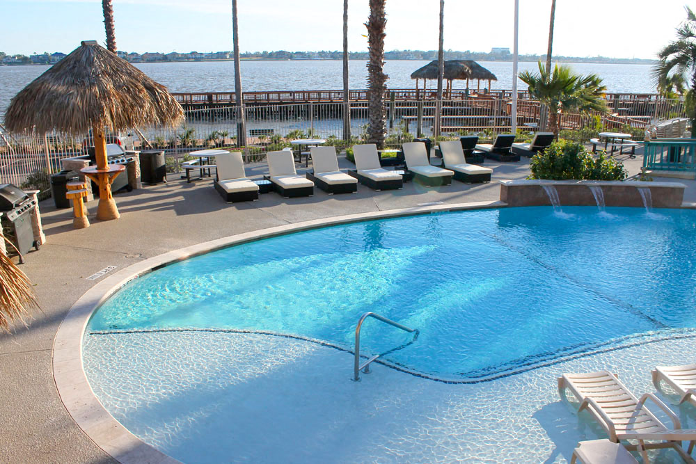 Pool with lounge chairs and view of